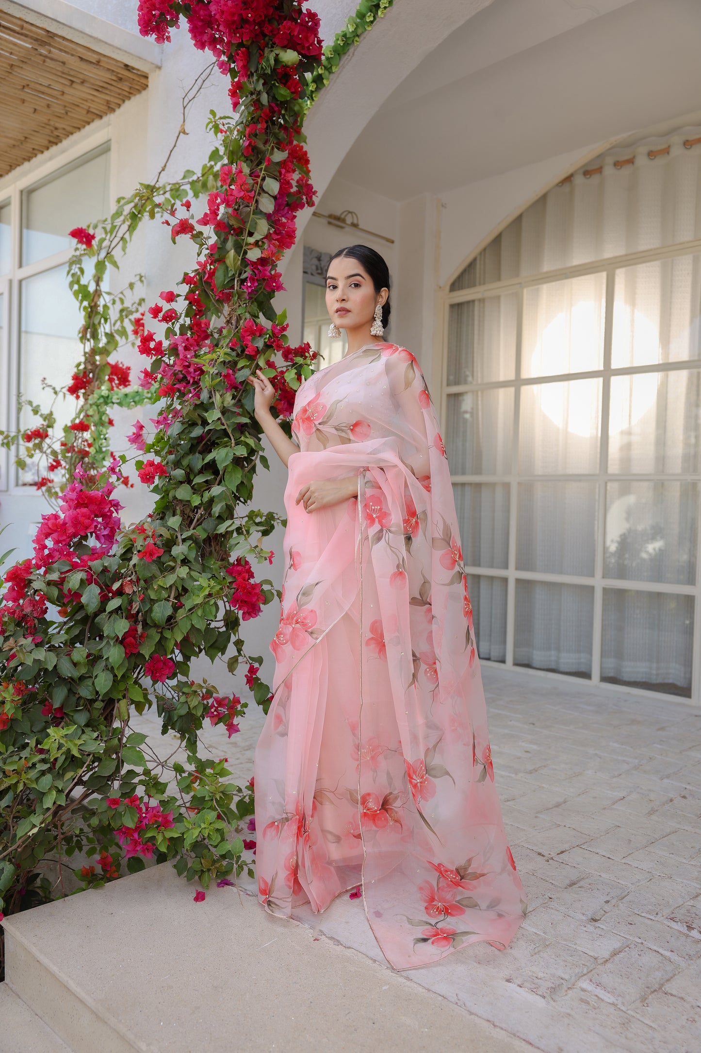 Hand-painted powder pink floral silk organza saree