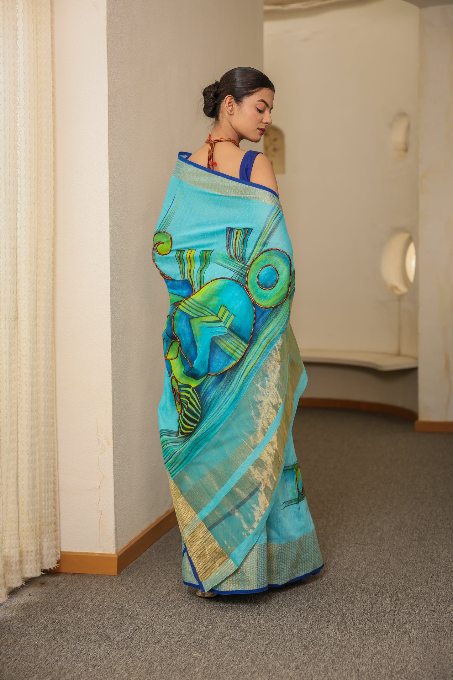 Hand-painted turquoise blue handloom cotton silk saree