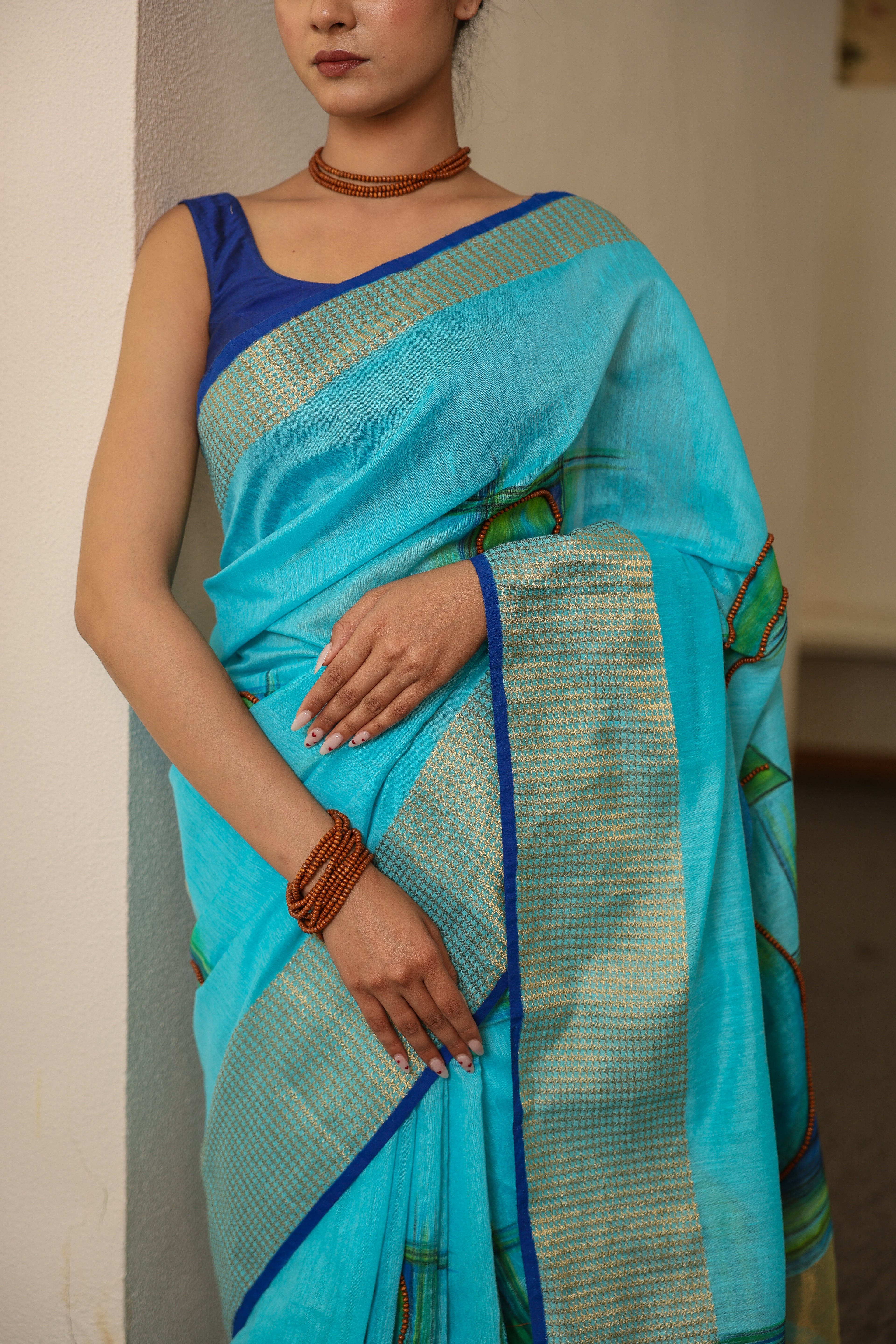 Handpainted and Hand embroidered Turquoise Blue khadi Silk Saree