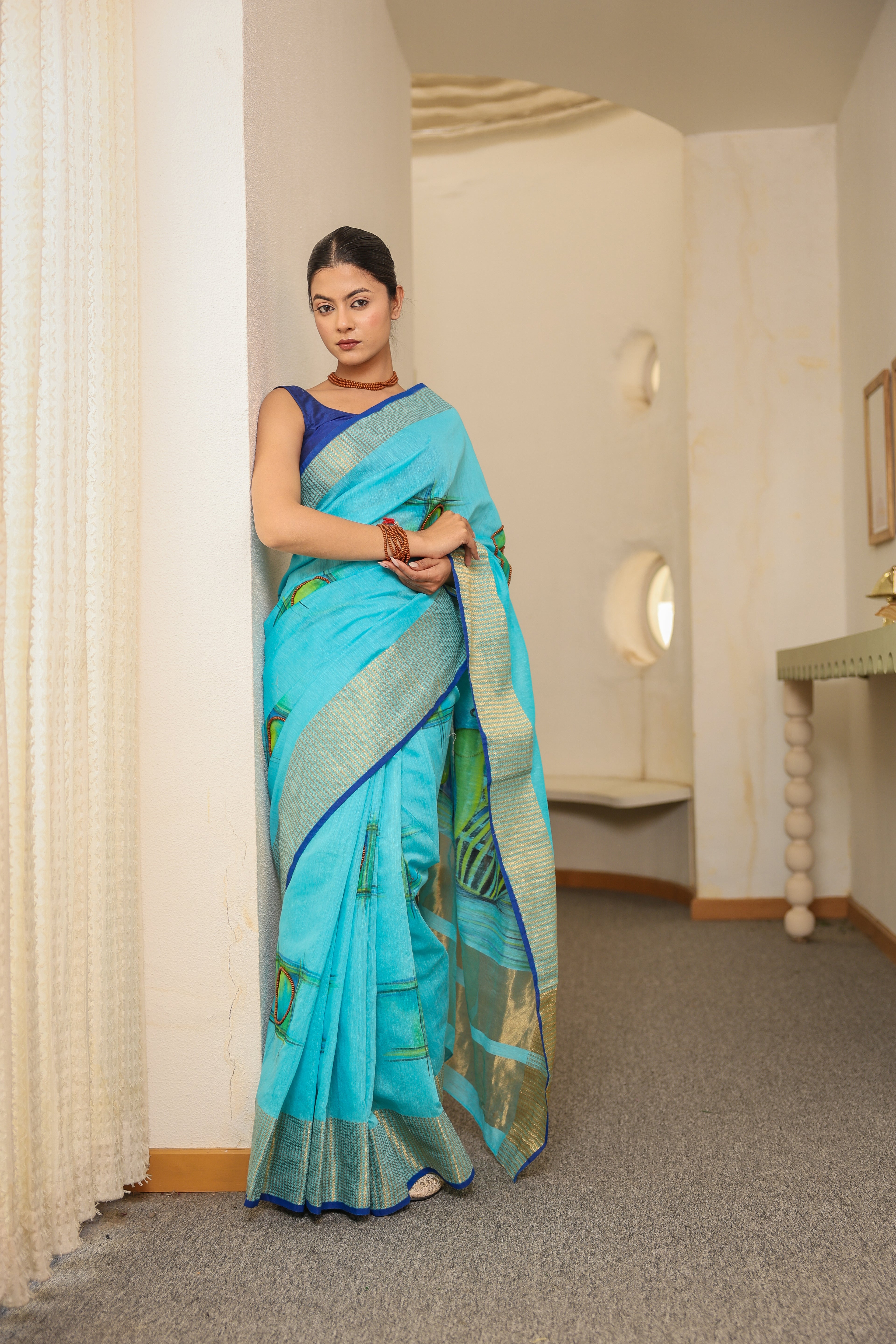 Handpainted and Hand embroidered Turquoise Blue khadi Silk Saree