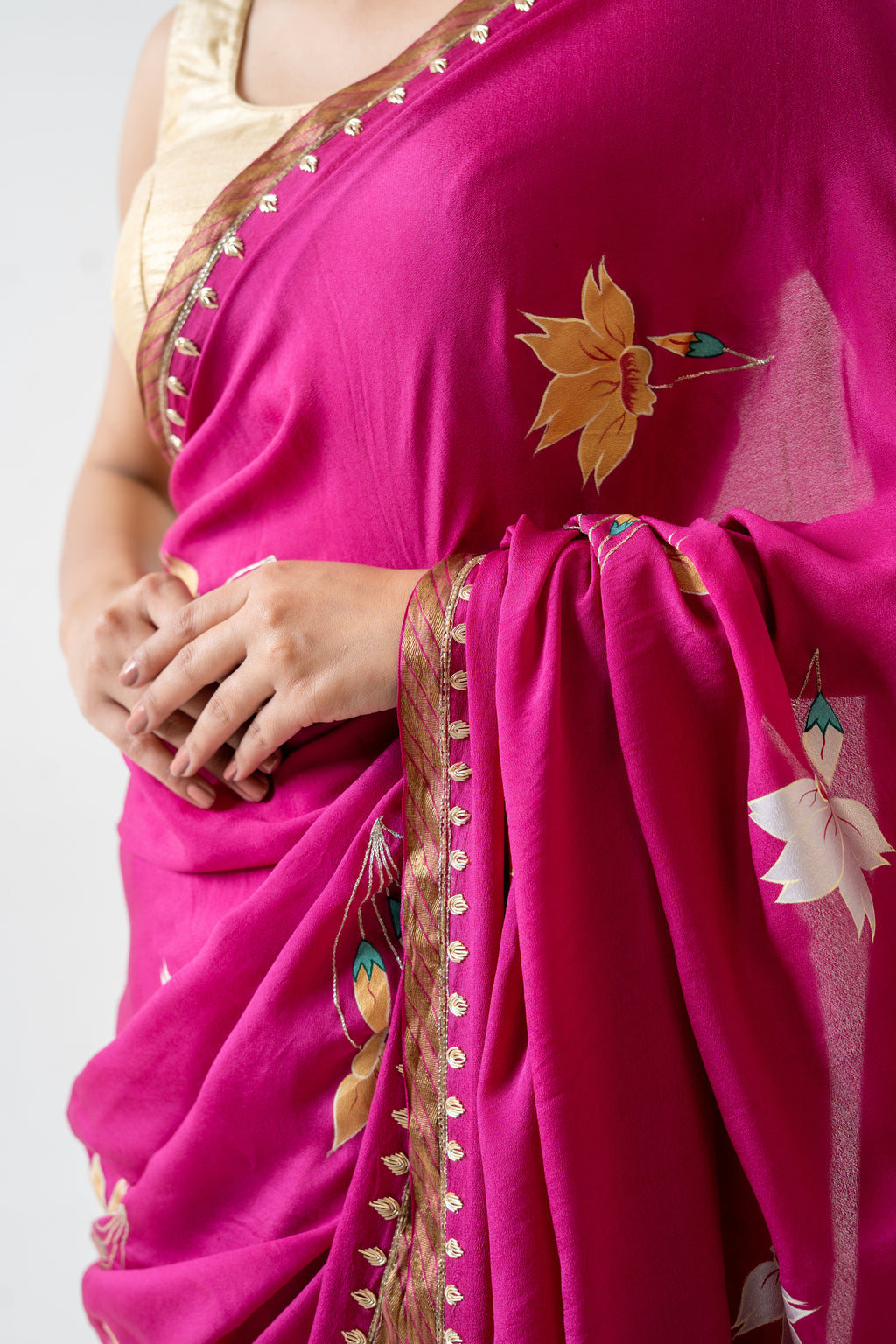 Handpainted and Hand embroidered Magenta Pure Crepe Silk saree
